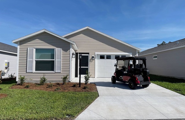 Golf & water views meet fresh style in this brand-new Florida retreat!