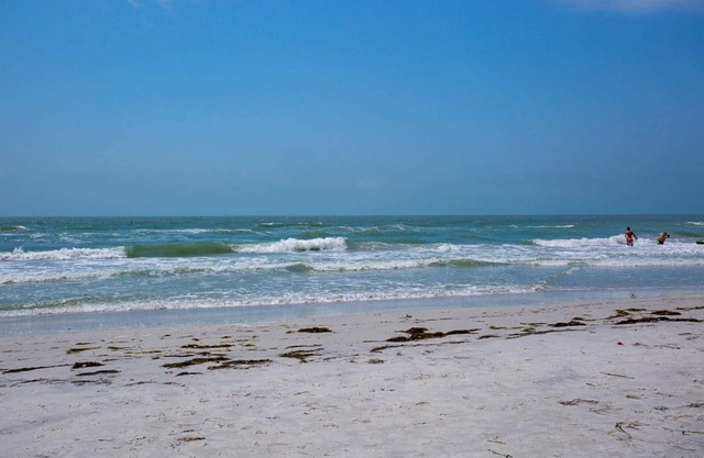Great Value! Steps to Beach - Large Patio Area ~ Heated Pool ~ Free Parking - Ground Floor Condo