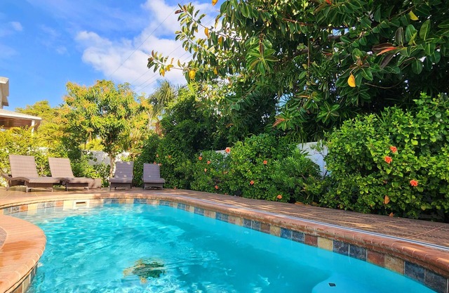Handicap accessible house one minute from a beach with a heated pool.