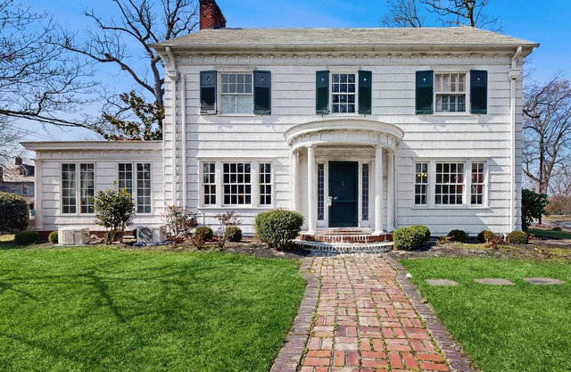 Historic dog-friendly home with a grassy yard, deck, washer/dryer, & central AC