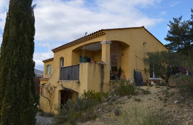 house at the foot of a hill