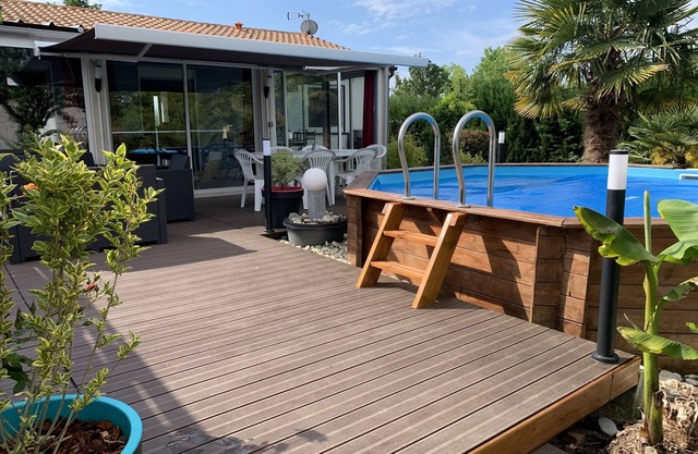 House with large veranda terrace and above-ground pool