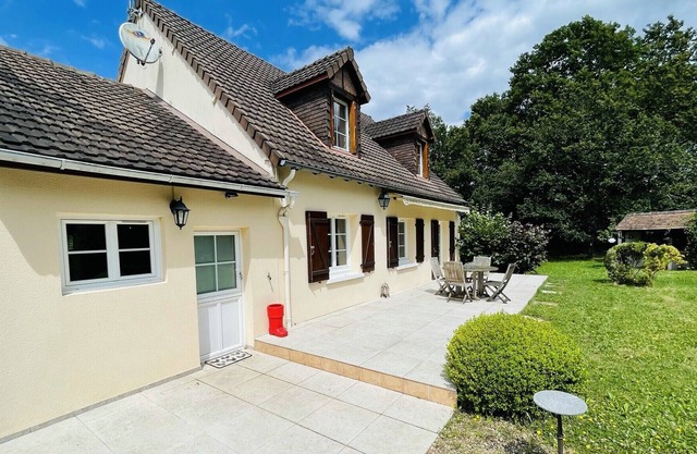 House in a green setting with swimming pool