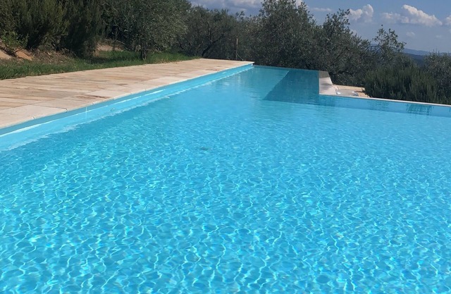 House in the woods with swimming pool.