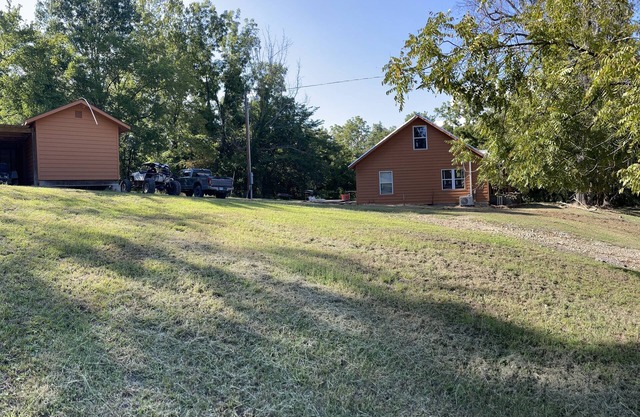 House on 80 acres that connect into the off road park! Extra cabins available.