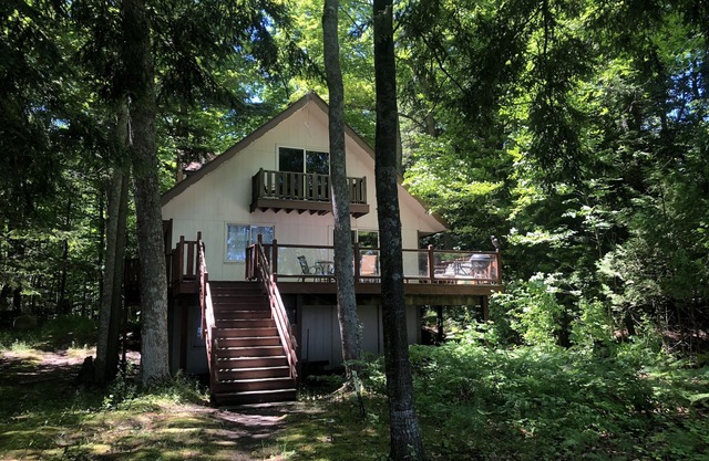 House on sandy beach in Omena. Budget friendly. Pet ok. Sunrise views.