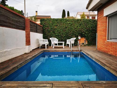 House with outdoor spaces and pool