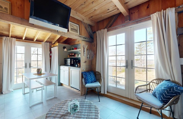 Idyllic cottage on five acres with great harbor views, large deck, & firepit