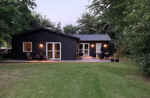 In the charming coastal town of Rågeleje, this lovely holiday home is located.