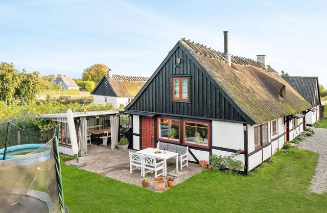 In the small station town of Tureby lies this cozy thatched house.
