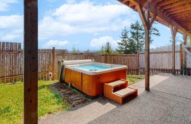 Inviting home with hot tub, water view, fireplace, pool table, & W/D