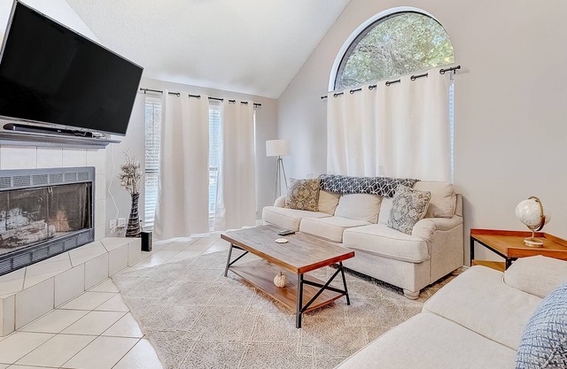 Inviting, two-story home on a large lot with a private pool, gas fireplace, & AC