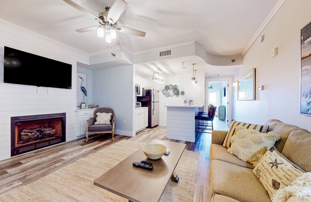 Inviting waterfront condo with heated outdoor pool, balcony, AC, & hot tub