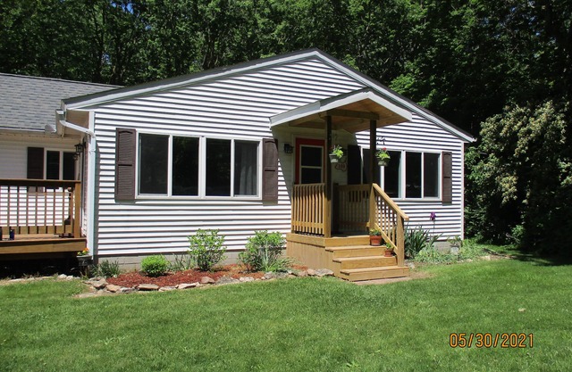 "Kelleys Island Escape" is a short walk from downtown Kelleys Island & sleeps 6.