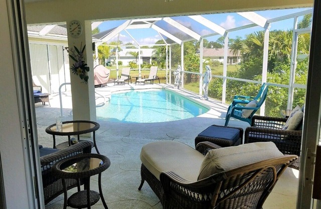 La dolce vita awaits in this immaculate pool home on fresh water canal.