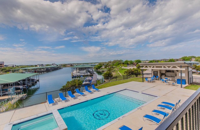 Lake front Condo 2BD/2BA w/pool, hot tub, fire pit, gas grills, gym, & laundry.