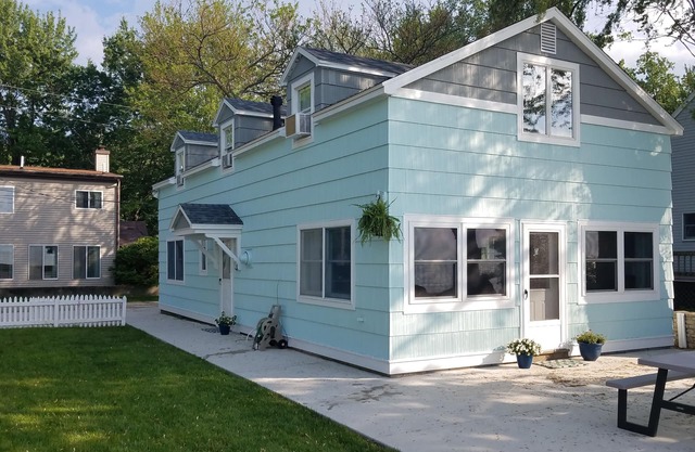 Lake Front Nautical Themed Home with Private Yard & Sandy Bottom Water Access!
