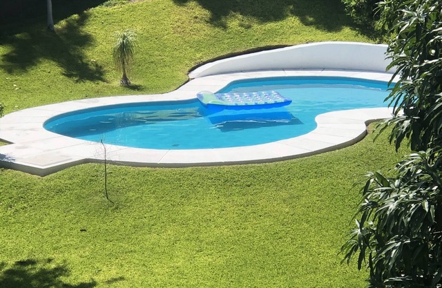 Lake front villa with private pool, beach, garden and terrace with lake views!