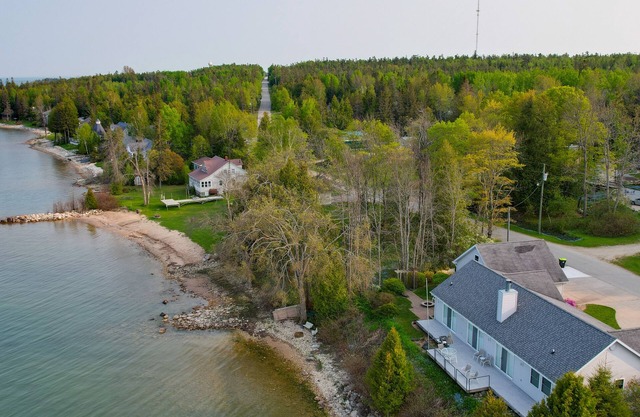 Lakefront De Tour Village Home w/Deck & Fire Pit!