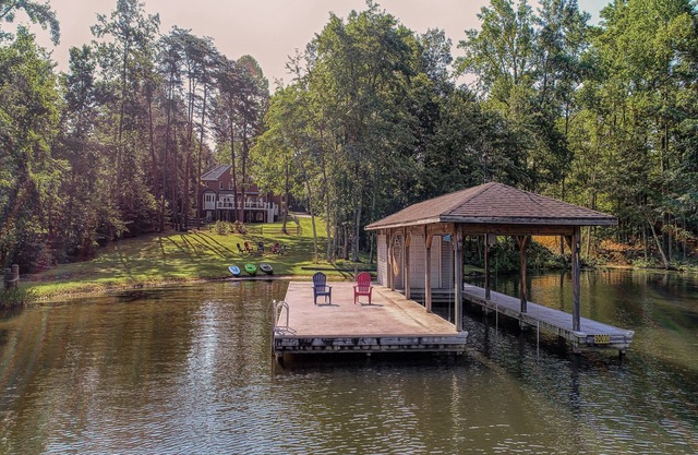 Lakefront home with boat dock, private firepit & game room - dog-friendly