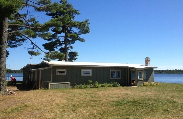 Lakefront, spectacular views with water on both sides, deep water dock.