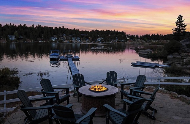 Lakefront Splendor:Spectacular Lakefront Property w/Private Dock! Pool Table + Foosball Table! Spacious Outdoor Deck! Patio & Yard w/Firepit!