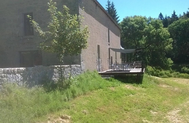 Large independent house overlooking a meadow and stream