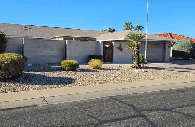 Large two bedroom home with private courtyard in and pool in Sun City.