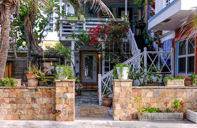 Located steps from the ocean, offering true beach living.