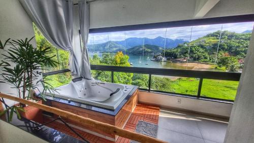 Loft Praia da Tartaruga com Hidromassagem
