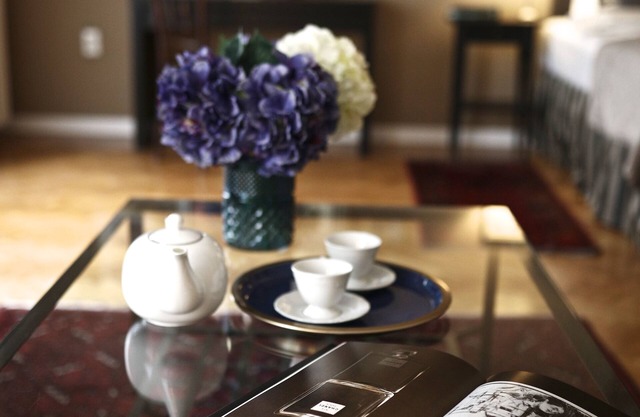 Luxurious sunlit suite in a prime location with a private city-view balcony, A/C