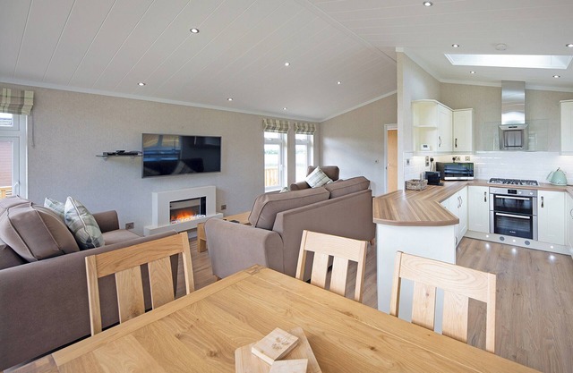 Luxury lodge with one double with en suite shower and two twin.
