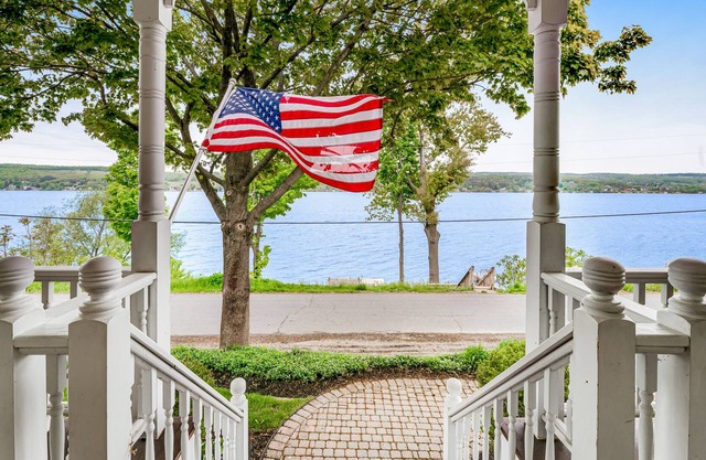 Majestic lakefront dog-friendly home with game room, fireplace, partial AC