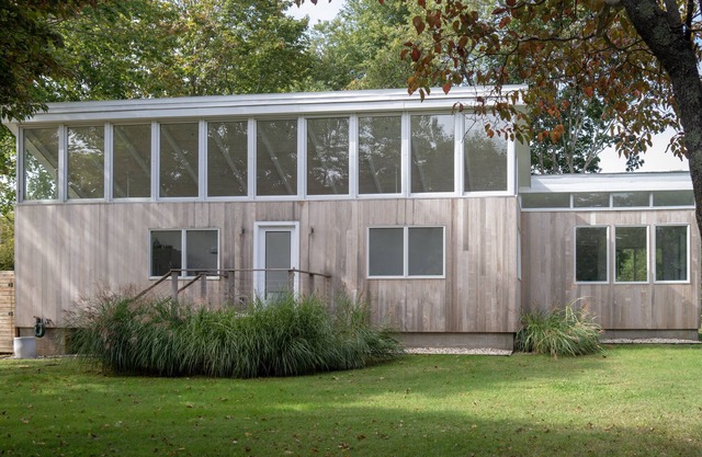 Mid-century on idyllic pasture like setting with pond