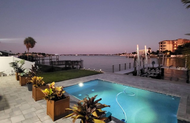 Million Dollar Views! Waterfront 2 bedroom/2 bath duplex with pool and dock.