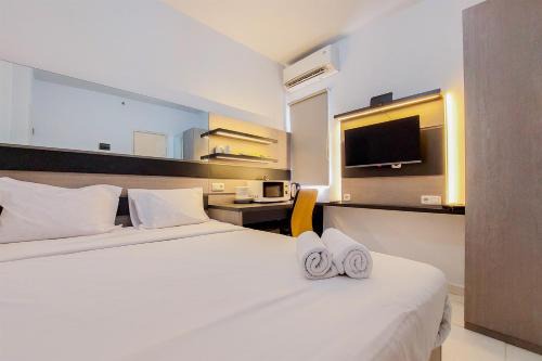 Minimalist Studio Apartment (No Kitchen) at Aeropolis Residence By Travelio