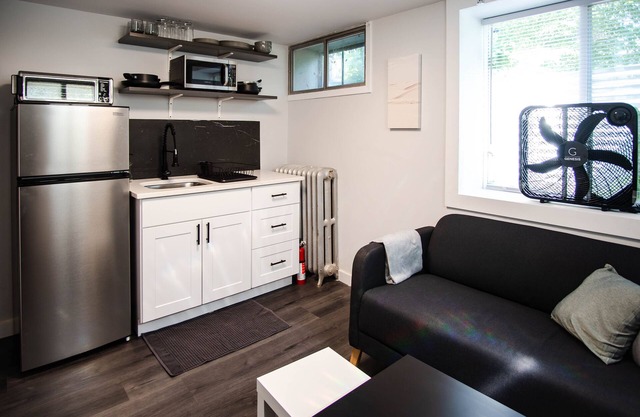 Modern 1 bed basement unit for traveling professionals with garage and laundryn