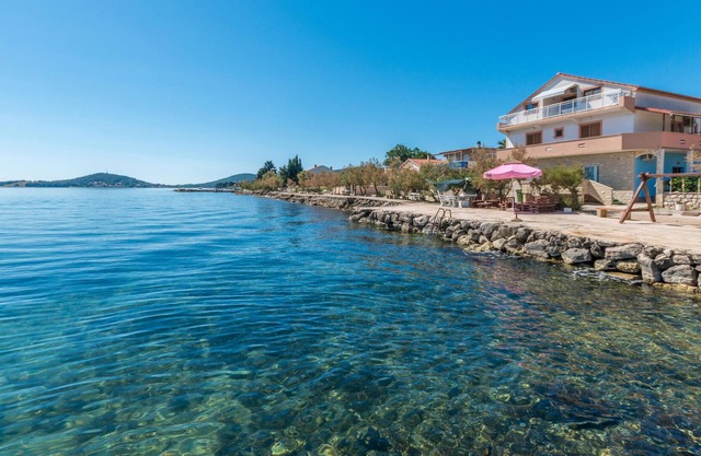 Modern vacation apartment directly by the sea.