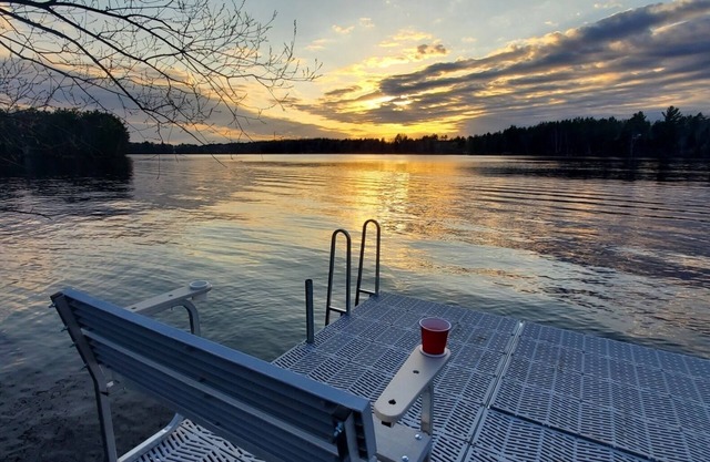 New cabin with lake-facing windows on 400-acre Long Lake of the Phillips Chain.