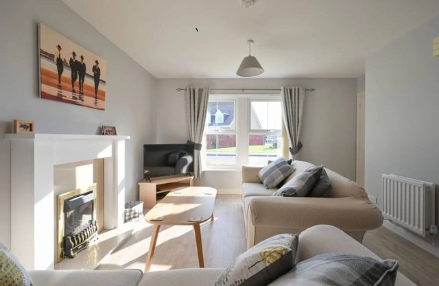 nStylish property with enclosed garden, parking and two minutes to the Golf Club