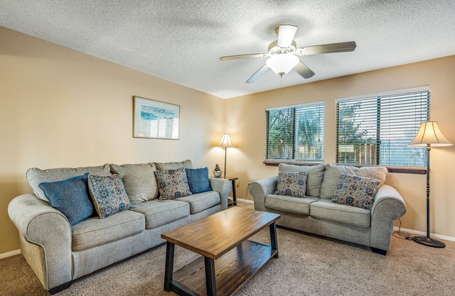 Oceanfront townhouse near beach with pool, balcony, central AC, & washer/dryer