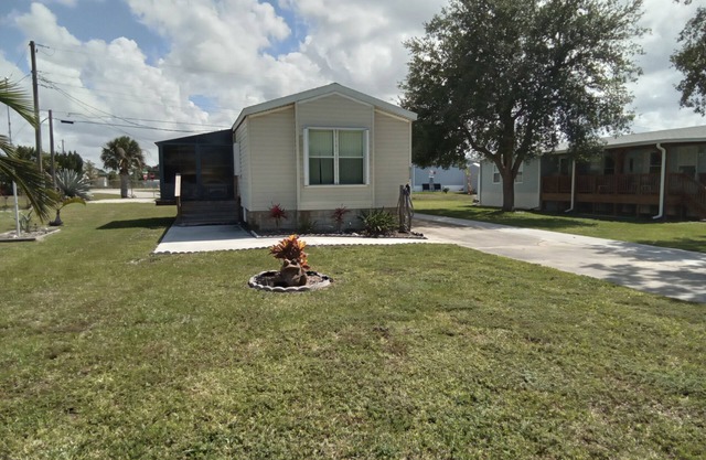 Open and inviting home with screened in porch.