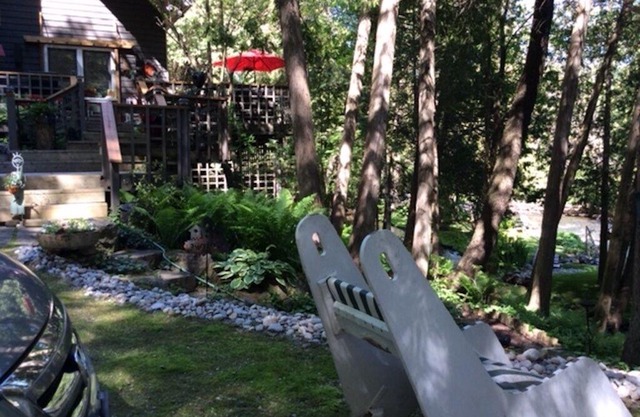PARADISE OVERLOOKING THE BUBBLING CREDIT RIVER SURRONDED BY LUSH MATURE GARDENS