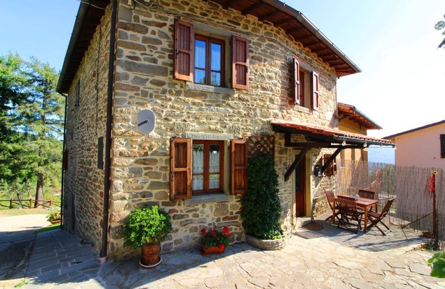 Part of an old stone country house enjoying a splendid panoramic view over the woods of the Casentin