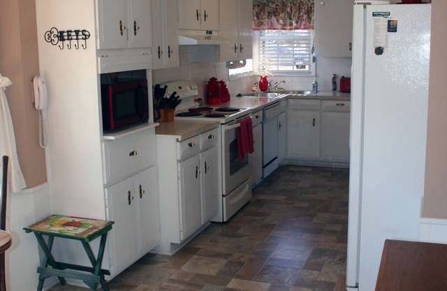 Perfectly located, east side w/fireplace, garage and fenced yard.