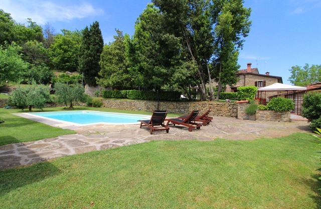 Portion of an old stone country house, well-kept garden and private swimming pool. Situated a few km