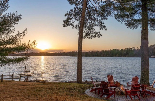 Pristine home with sandy beach, firepit, dock and pontoon. ATV trails nearby.
