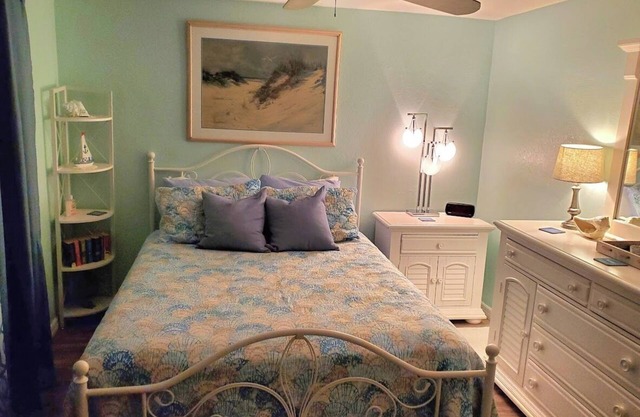 Private bedroom and private bath at separate end of home with water views.