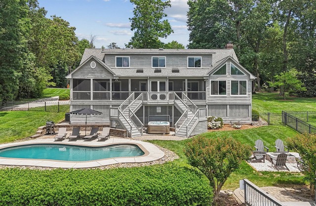 Private Waterfront Home with heated pool, hot tub, firepit, kayaks, game room and much more!