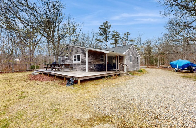Quaint home across from bike paths with large furnished deck, grill, & W/D